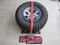 Picture of N-Fab Bed Mounted Tire Carrier Universal - Gloss Black - Red Strap