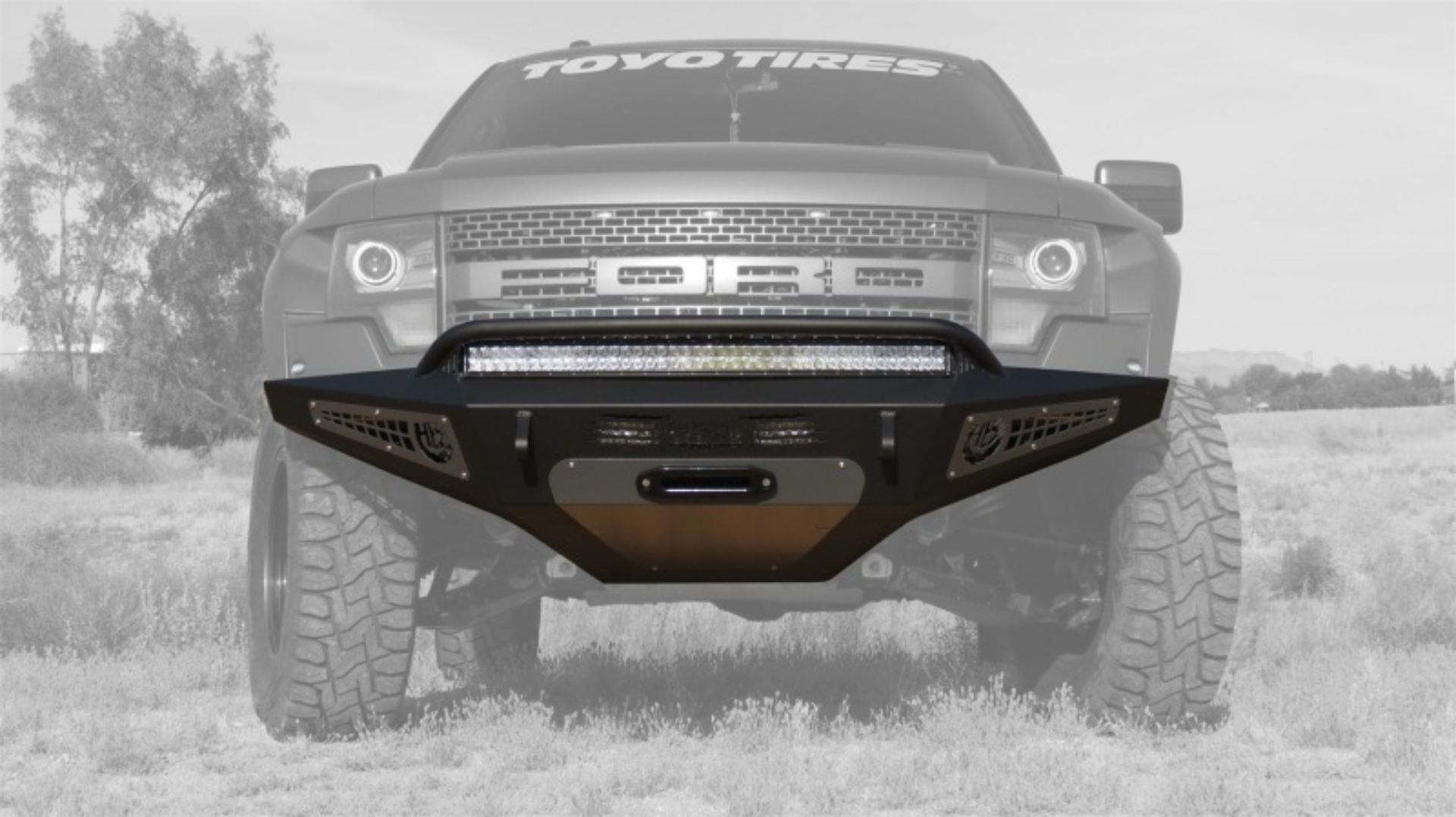 Picture of Addictive Desert Designs 10-14 Ford F-150 Raptor HoneyBadger Front Bumper w- Winch Mount