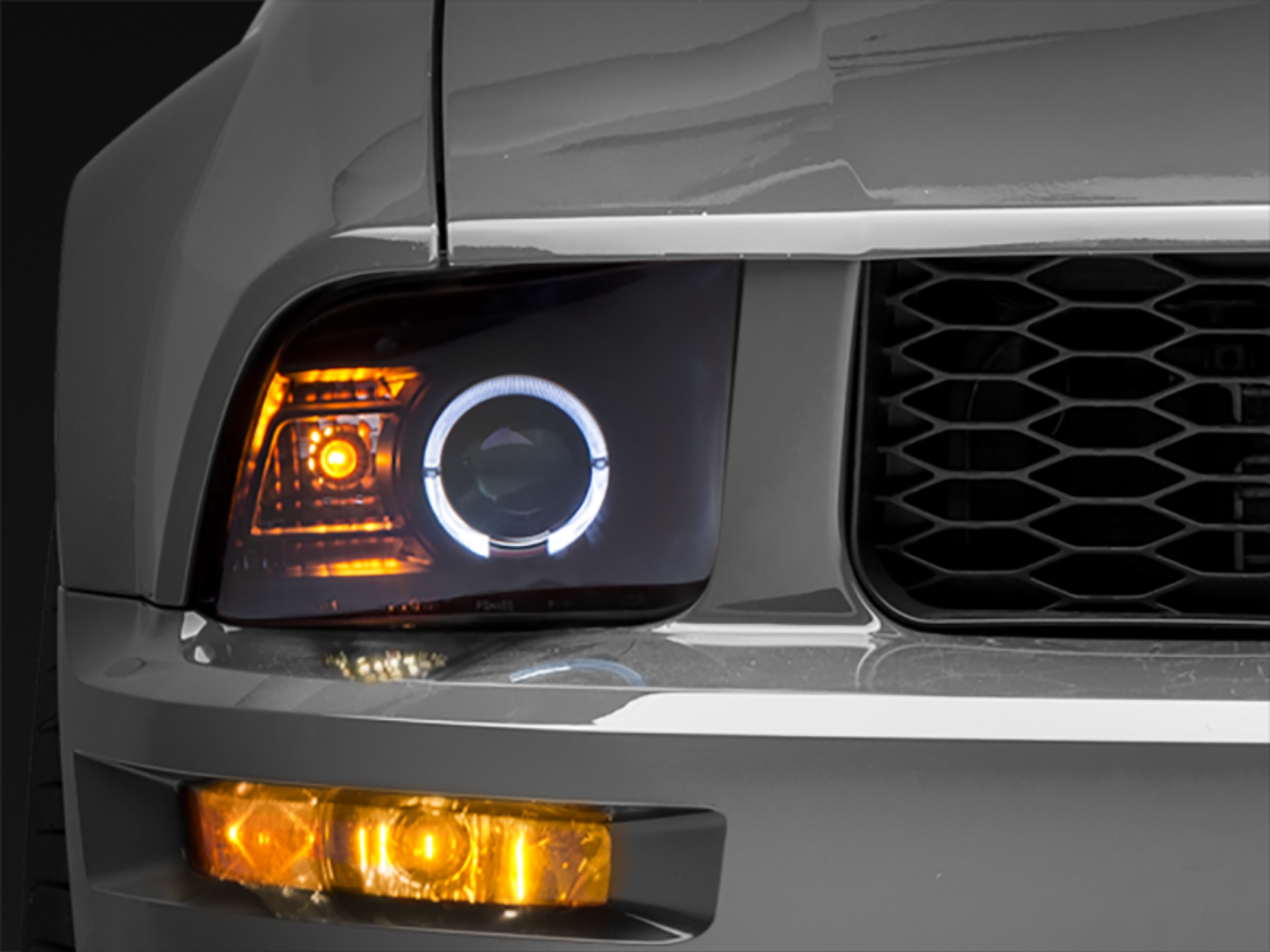 Picture of Raxiom 05-09 Ford Mustang Halogen 2010 Style LED Halo Headlights-Blk HsngClear Lens-Excludes GT500