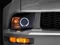 Picture of Raxiom 05-09 Ford Mustang Halogen 2010 Style LED Halo Headlights-Blk HsngClear Lens-Excludes GT500